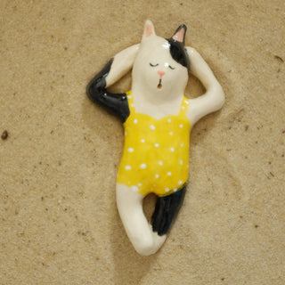 Black and white cat in yellow Ceramic Figure