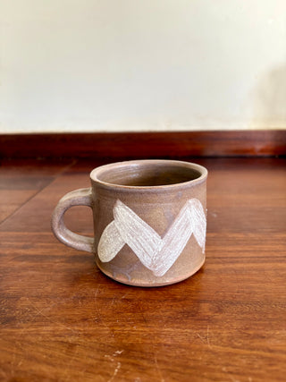 Slip-decorated mugs