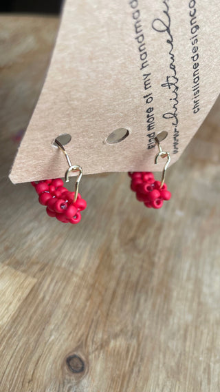 Small matte red knitted hoops