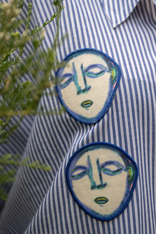 Upcycled blue & white striped shirt with Faces Patches