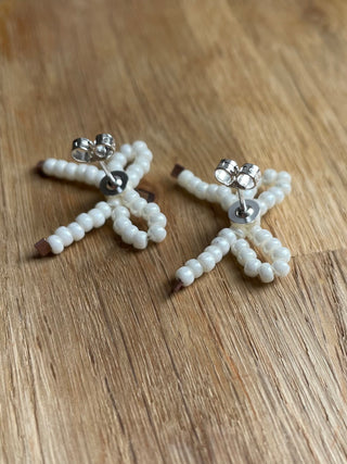 White pearl bow studded earrings